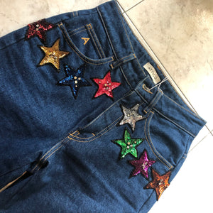 Jeans con stelline in paillettes